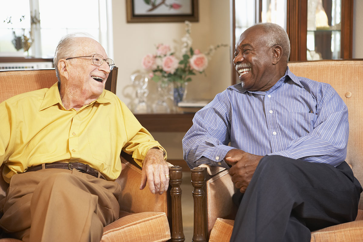 Residents laughing together at The Savoy